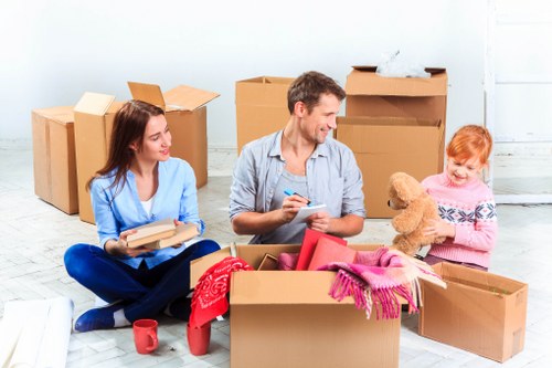 Unpacking boxes in a central London apartment after a move