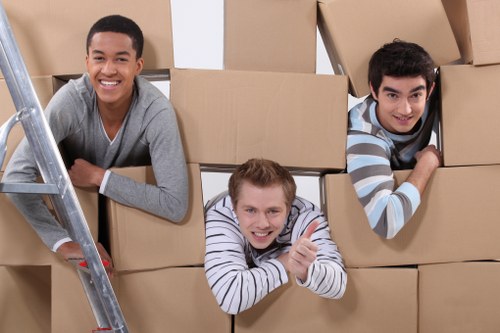 Careful handling of boxes and furniture inside a Fitzrovia flat