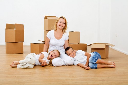 Professional movers carrying furniture in a Fitzrovia property